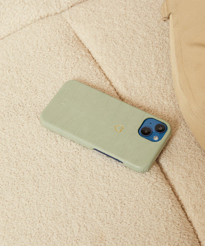 iPhone case in mint green color face down showing the elegance of vegan leather and durability