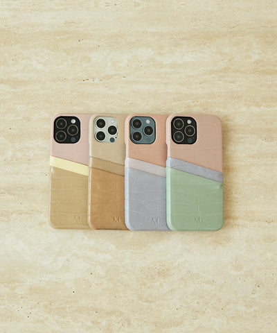 Four card holder iPhone cases in four colors stacked together